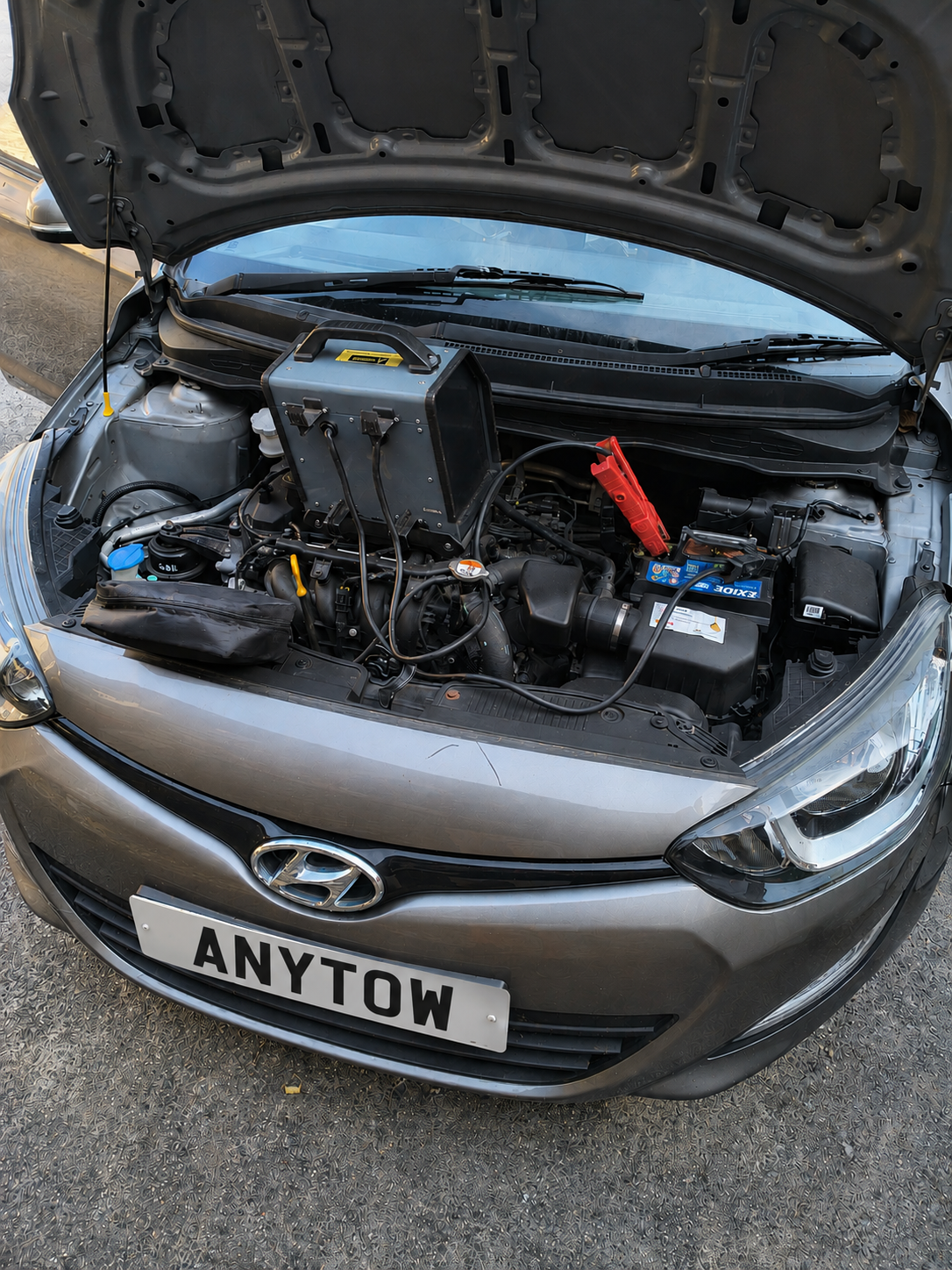 ANYTOW jump start equipment connected to a car battery in Abingdon